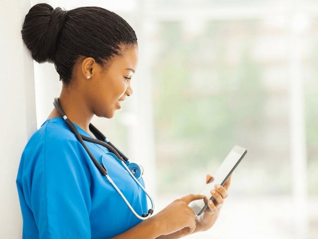 nurse looking at tablet