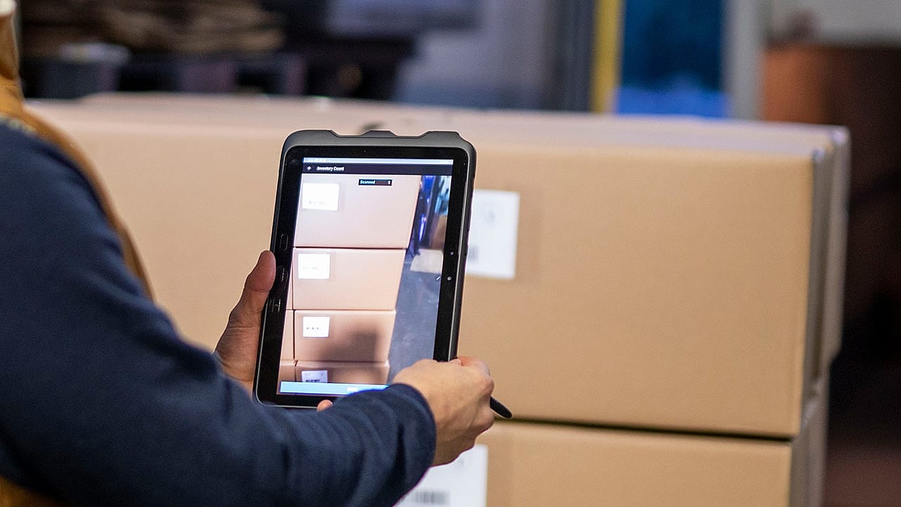 warehouse tablet scanning packages